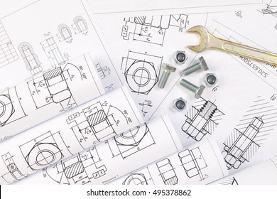 Mechanical Engineering Technology. Wrench, Nuts And Bolts On Paper Drawings