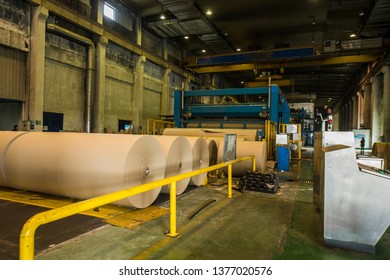 Mechanical Equipment and Yellow Board Paper Products Produced in a Paper Mill Workshop  - Shutterstock ID 1377020576