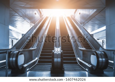 Mechanical escalator in the international airport or modern subway train station