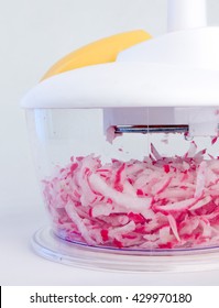 Mechanical Kitchen Grater Is Filled With Shredded Red Radish