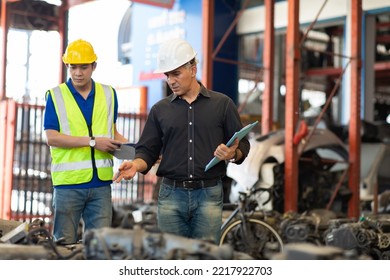 Mechanical Man Owner Small Business Inspecting Old Car Parts Stock On Laptop Computer While Working In Old Automobile Parts Large Warehouse