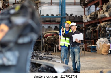 Mechanical Man Owner Small Business Inspecting Old Car Parts Stock On Laptop Computer While Working In Old Automobile Parts Large Warehouse