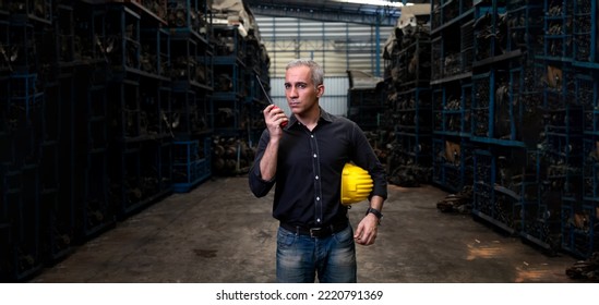 Mechanical Man Owner Small Business Inspecting Old Car Parts Stock On Laptop Computer While Working In Old Automobile Parts Large Warehouse