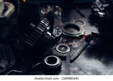 Mechanical Parts Of Car In Car Repair Shop. Dark Tone.