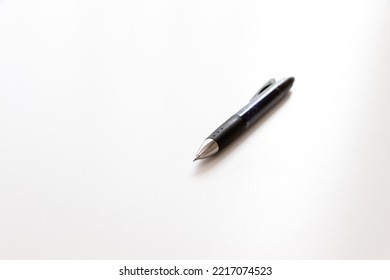 A Mechanical Pencil With A Little Lead Protruding From The Nib