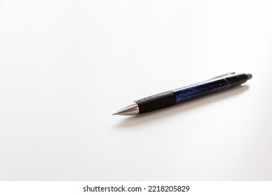 A Mechanical Pencil With A Little Lead Protruding From The Nib