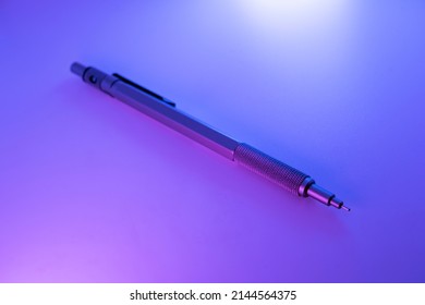 Mechanical Pencil Under Hard Colored Lights.