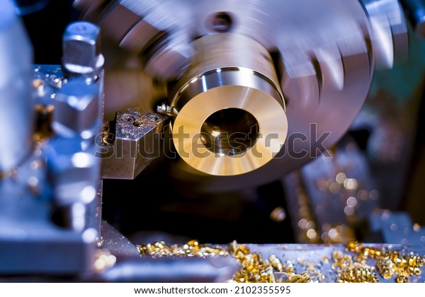 Mechanical processing of bronze parts on a lathe\
with a specialized\
cutter.
