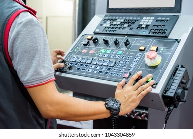 Mechanical technician operating program on control panel of high precision CNC machining center, machining die metal mold process in factory - Powered by Shutterstock