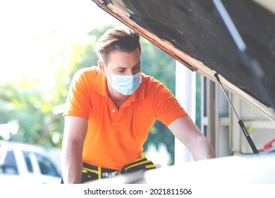 Mechanical Wearing Face Mask Protec Covid Virus. Mechanic Working In A Car Service Station