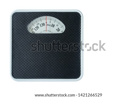 Mechanical weight scale, body mass control concept : Bathroom scale isolated on white background. Analog scale operated with spring that pressure is calibrated to translate tension into a mass readout