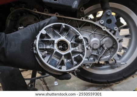 Mechanical working on automatic CVT transmission of scooter mortorcycle repair belt and clutch transport businness