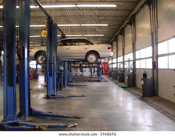 Mechanics Garage Car On Hoist Stock Photo Edit Now 5968696