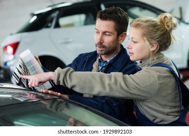 Mechanics Matching Color Samples Against Car