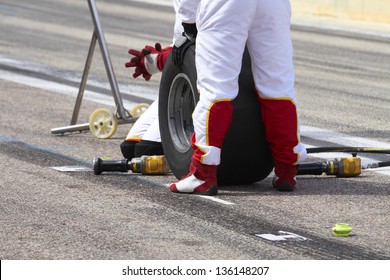 Mechanics At Pitstop Prepared To Change The Tires Of A Car Competition.