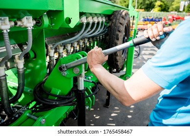 The Mechanics Repair Combine Harvester. Modern Agricultural Machinery