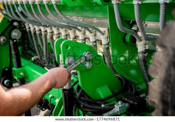 The mechanics repair combine harvester. Modern\
agricultural machinery