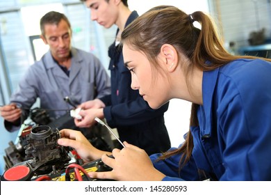 Mechanics training class with teacher and students