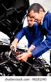 Mechanics Working Garage Fixing Car Stock Photo 98181590 | Shutterstock