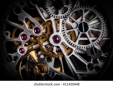 Mechanism, clockwork of a watch with jewels, close-up. Vintage luxury background. Time, work concept.