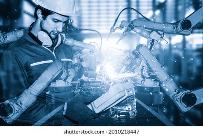 Mechanized Industry Robot Arm And Factory Worker Double Exposure . Concept Of Robotics Technology For Industrial Revolution And Automated Manufacturing Process .