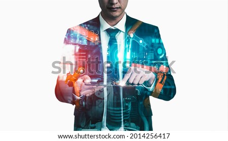Mechanized industry robot arm and factory worker double exposure . Concept of robotics technology for industrial revolution and automated manufacturing process .