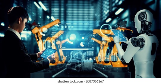 Mechanized industry robot and human worker working together in future factory . Concept of artificial intelligence for industrial revolution and automation manufacturing process . - Shutterstock ID 2087366167