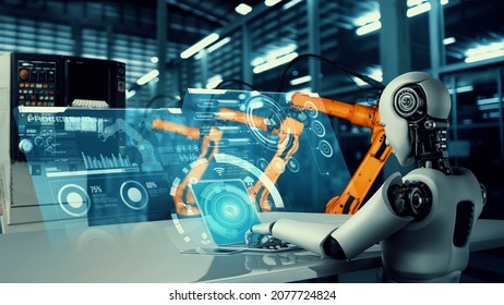 Mechanized Industry Robot And Robotic Arms For Assembly In Factory Production . Concept Of Artificial Intelligence For Industrial Revolution And Automation Manufacturing Process .