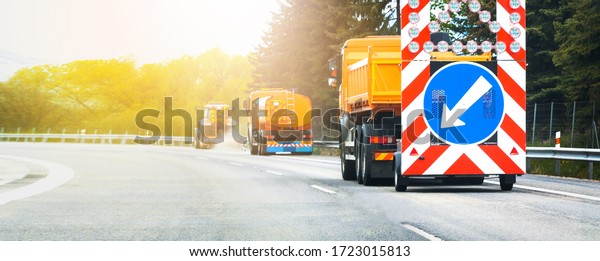 Mechanized truck road cleaning service on\
the highway after winter. Remove winter\
grid.