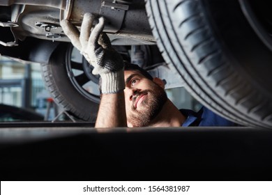 Mechatronics Engineer Or Mechanic In The Repair Of Car Exhaust For Main Inspection