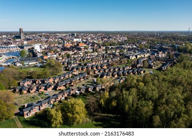 Mechelen, Antwerp Belgium - Jun 1 2022: Drone aerial photo of the Battel district of Mechelen with the city in the background with its Sint Rombouts Cathedral, photographed in a south-east direction.