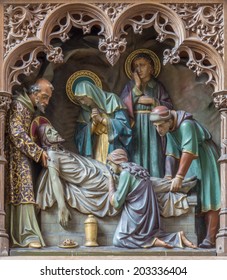 MECHELEN, BELGIUM - JUNE 14, 2014: Carved statues of scene the Burial of Jesus on new gothic side altar of church Our Lady across de Dyle. 
