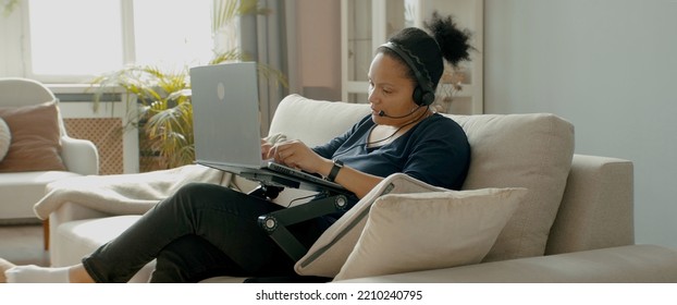 MED Portrait Of Adult Black African American Female Working From Home, Receiving A Phone Call From Client Or Office. WFH, Stay Home