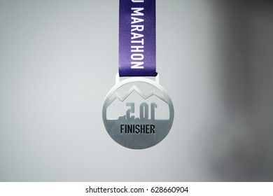 The Medal Of The Mini-marathon 10.5k Running Finisher