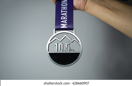 The Medal Of The Mini-marathon 10.5k Running Finisher