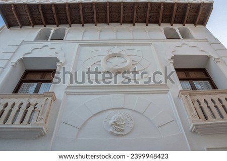 Medallion with the portrait of a knight and the inscription “CERVANTES” on the facade of the 16th century Cervantes House eclectic building with Mudejar elements in an old town of Altea, Spain