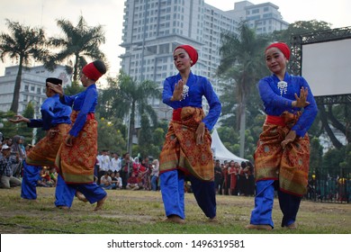 Medan, Indonesia - ca 2019: Zapin dance performances from traditional Malay traditional dancers to celebrate the youth carnival in Medan, they were invited from Riau.
