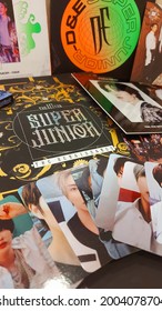 Medan, Indonesia- June 25th, 2021 : Kpop Idol Album Super Junior And Piles Of Other Merchandise.