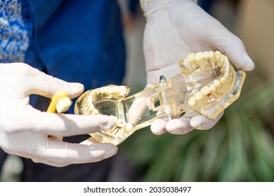 Medan, Indonesia - Mei, 15 2021. A Man Teaches Orphanage Children To Use Toothbrushes And Provides Dental Health Education To Children.