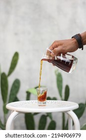 Medan May 2021 - A V-60 Coffee That Is Poured Into A Small Glass To See The Splash Of Bulk Water