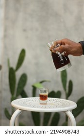 Medan May 2021 - A V-60 Coffee That Is Poured Into A Small Glass To See The Splash Of Bulk Water