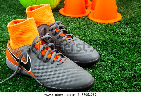 turf soccer shoes on grass