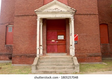 Medfield, MA - August 15 2020: Doorway Outside The Abandoned Dining Hall At Medfield State Hospital, Former Mental Illness Asylum And Movie Filming Location For Shutter Island And The New Mutants