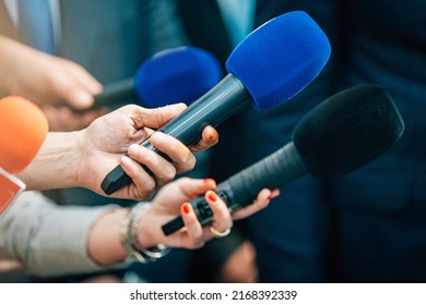 Media interview microphones after a press conference. - Shutterstock ID 2168392339