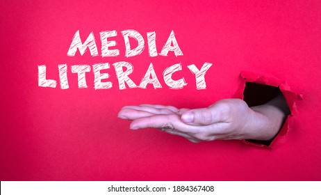 Media Literacy. False News, Social Media And Skills Concept. Red Paper Background