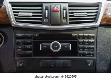 media system on the control panel of the car, the management console, emergency stop button, car interior Close-up
