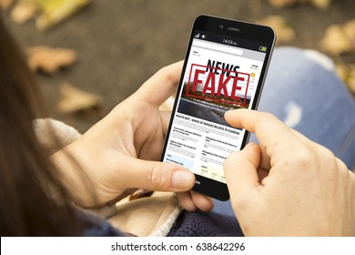media technology and modern lifestyle concept: young woman with smartphone reading fake news at the park - Shutterstock ID 638642296