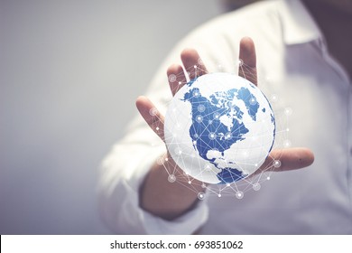 Media worldwide technology concept and Businessman hands carrying world map - rule the world, world domination concepts - Powered by Shutterstock - Get 15% off with code: PIKWIZARD15