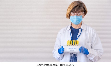 Medial Staff Distributing Covid-19 Vaccine Tray Of The Freezer. 