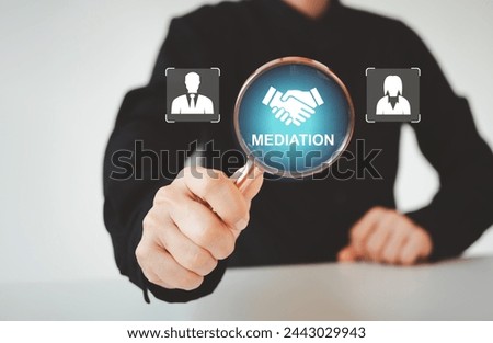Mediation concept. Mediation between married couples, divorce and the role of the mediator. Businessman use magnifying glass focus to icon of woman and man and mediation on virtual screen.
